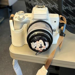 Lumix 35–100mm silver digital camera – detachable zoom lens, textured grip, pro controls, compact body, high resolution, stylish finish, travel-ready