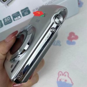 Lumix 35–100mm silver digital camera – detachable zoom lens, textured grip, pro controls, compact body, high resolution, stylish finish, travel-ready